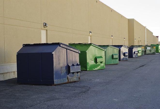 construction waste bins waiting to be picked up by a waste management company in Calhoun